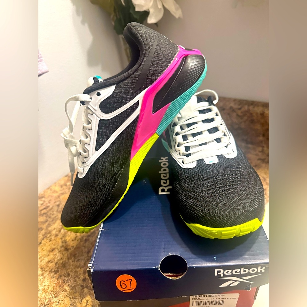 Reebok Black and Pink Athletic Shoes with Modern Design